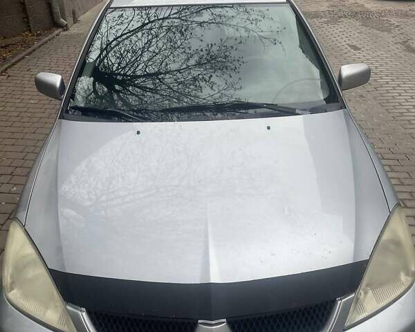 Сірий Міцубісі Lancer, об'ємом двигуна 1.58 л та пробігом 315 тис. км за 2350 $, фото 7 на Automoto.ua