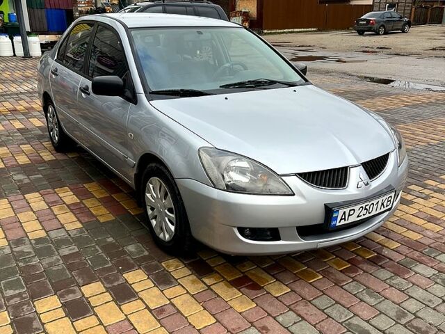 Сірий Міцубісі Lancer, об'ємом двигуна 1.6 л та пробігом 236 тис. км за 3800 $, фото 1 на Automoto.ua