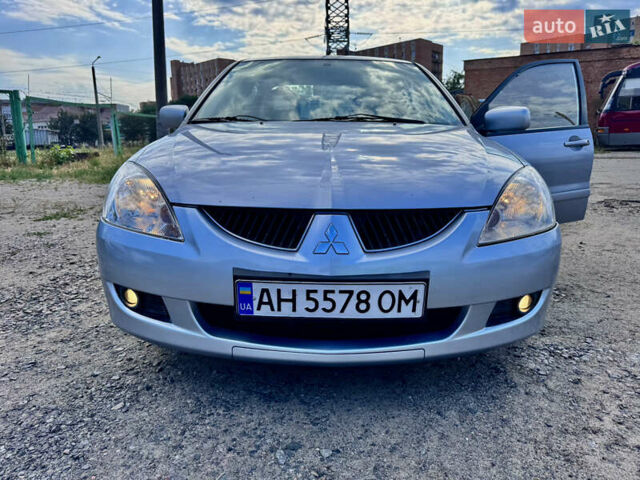 Сірий Міцубісі Lancer, об'ємом двигуна 1.58 л та пробігом 292 тис. км за 5000 $, фото 3 на Automoto.ua