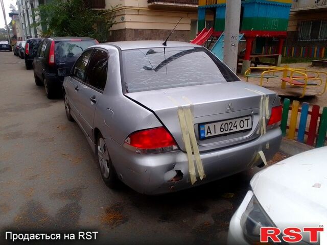 Сірий Міцубісі Lancer, об'ємом двигуна 1.6 л та пробігом 360 тис. км за 1999 $, фото 4 на Automoto.ua