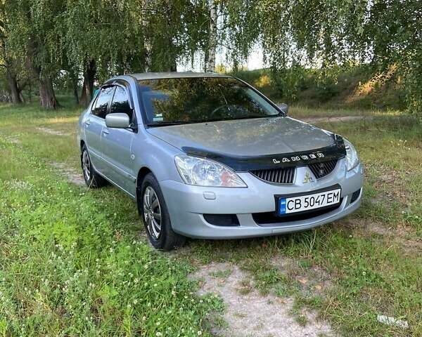 Сірий Міцубісі Lancer, об'ємом двигуна 1.58 л та пробігом 130 тис. км за 4600 $, фото 4 на Automoto.ua