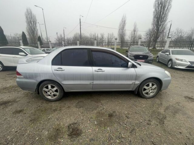 Серый Мицубиси Лансер, объемом двигателя 1.6 л и пробегом 200 тыс. км за 3906 $, фото 2 на Automoto.ua