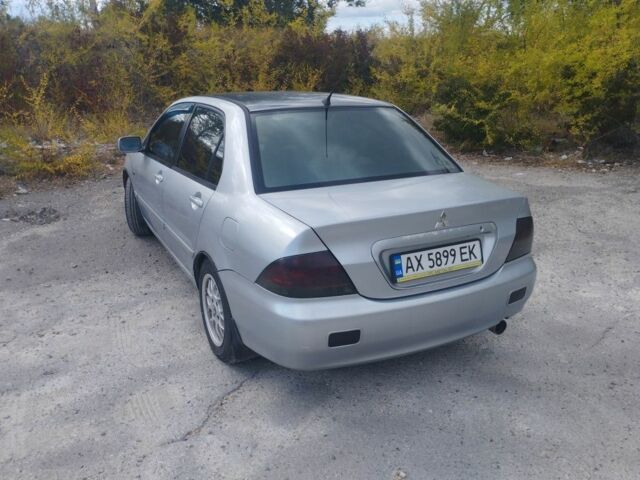 Сірий Міцубісі Lancer, об'ємом двигуна 1.6 л та пробігом 244 тис. км за 3300 $, фото 5 на Automoto.ua