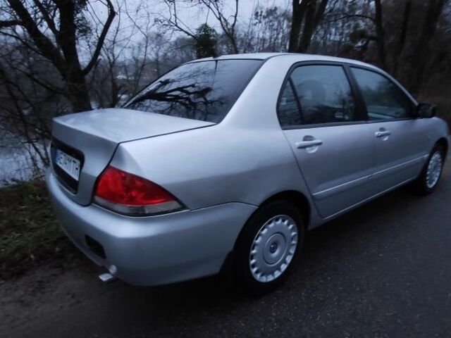 Серый Мицубиси Лансер, объемом двигателя 1.6 л и пробегом 235 тыс. км за 2850 $, фото 11 на Automoto.ua