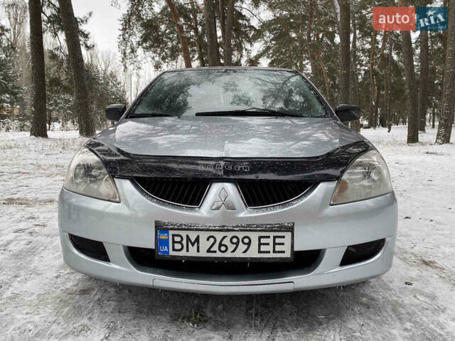 Серый Мицубиси Лансер, объемом двигателя 1.58 л и пробегом 225 тыс. км за 3950 $, фото 3 на Automoto.ua
