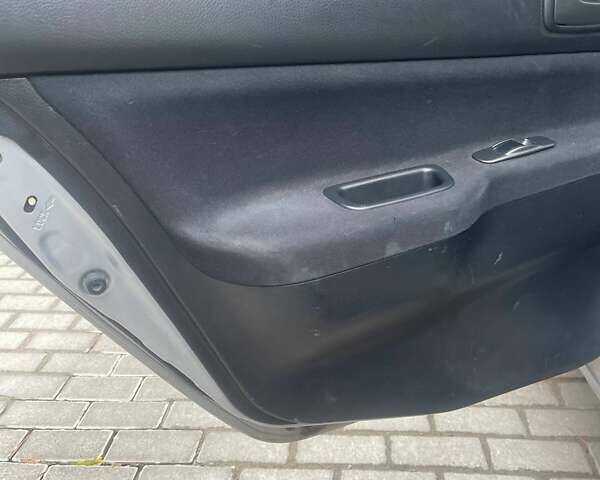 Сірий Міцубісі Lancer, об'ємом двигуна 1.58 л та пробігом 315 тис. км за 2350 $, фото 2 на Automoto.ua