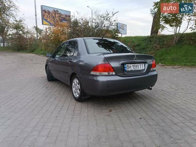 Сірий Міцубісі Lancer, об'ємом двигуна 1.58 л та пробігом 238 тис. км за 5500 $, фото 3 на Automoto.ua