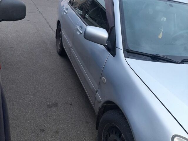 Сірий Міцубісі Lancer, об'ємом двигуна 1.6 л та пробігом 27 тис. км за 4200 $, фото 2 на Automoto.ua