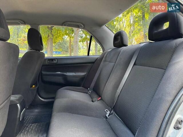 Серый Мицубиси Лансер, объемом двигателя 1.6 л и пробегом 196 тыс. км за 4490 $, фото 22 на Automoto.ua