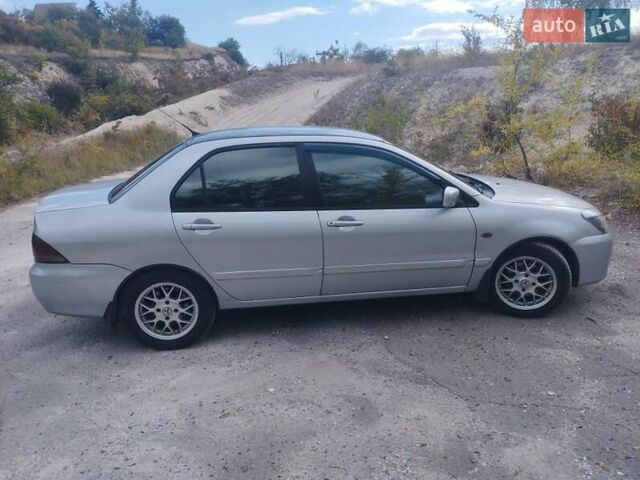 Сірий Міцубісі Lancer, об'ємом двигуна 1.6 л та пробігом 244 тис. км за 3300 $, фото 2 на Automoto.ua