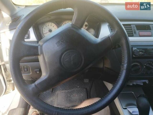 Сірий Міцубісі Lancer, об'ємом двигуна 1.6 л та пробігом 244 тис. км за 3300 $, фото 7 на Automoto.ua