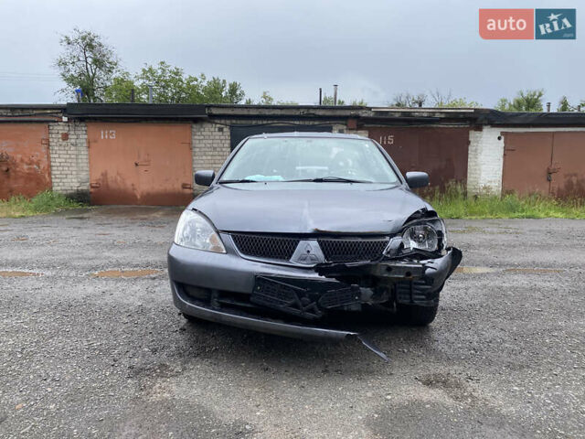 Сірий Міцубісі Lancer, об'ємом двигуна 1.58 л та пробігом 97 тис. км за 2000 $, фото 3 на Automoto.ua