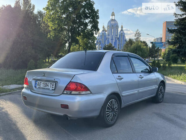 Сірий Міцубісі Lancer, об'ємом двигуна 1.58 л та пробігом 292 тис. км за 3800 $, фото 5 на Automoto.ua