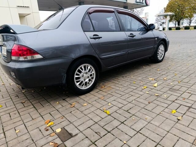 Серый Мицубиси Лансер, объемом двигателя 1.6 л и пробегом 100 тыс. км за 3500 $, фото 4 на Automoto.ua