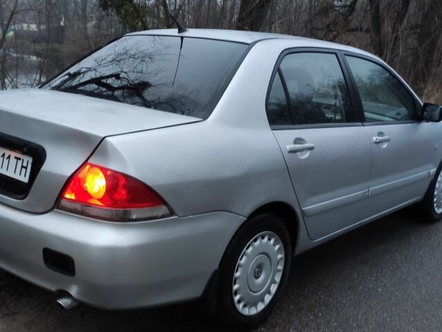 Серый Мицубиси Лансер, объемом двигателя 1.6 л и пробегом 235 тыс. км за 2850 $, фото 2 на Automoto.ua