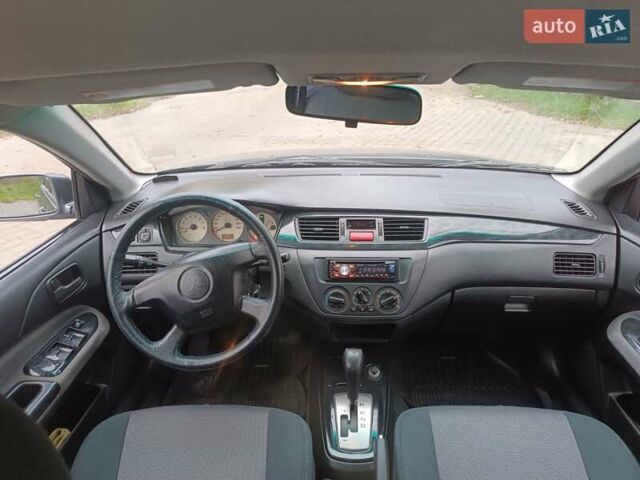 Сірий Міцубісі Lancer, об'ємом двигуна 1.58 л та пробігом 238 тис. км за 5500 $, фото 11 на Automoto.ua