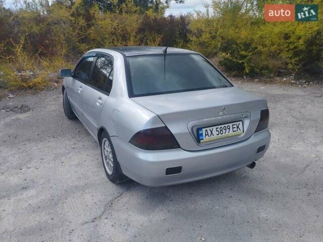 Сірий Міцубісі Lancer, об'ємом двигуна 1.6 л та пробігом 244 тис. км за 3300 $, фото 4 на Automoto.ua