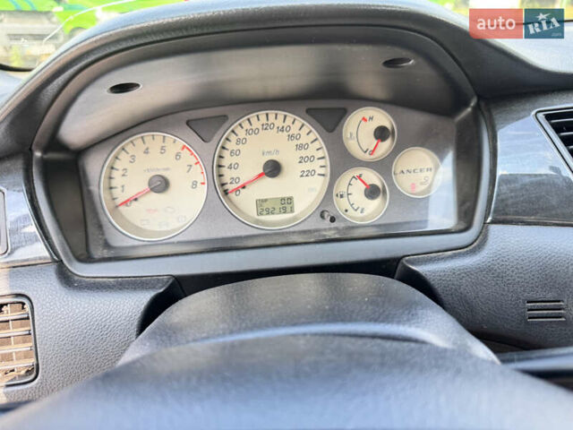 Сірий Міцубісі Lancer, об'ємом двигуна 1.58 л та пробігом 292 тис. км за 5000 $, фото 24 на Automoto.ua