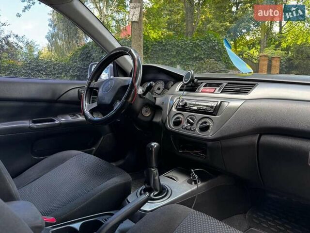 Серый Мицубиси Лансер, объемом двигателя 1.6 л и пробегом 196 тыс. км за 4490 $, фото 25 на Automoto.ua