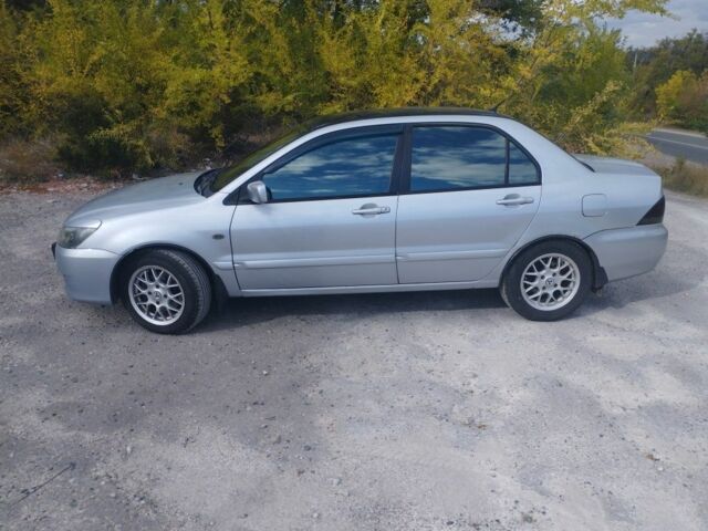 Сірий Міцубісі Lancer, об'ємом двигуна 1.6 л та пробігом 244 тис. км за 3300 $, фото 6 на Automoto.ua