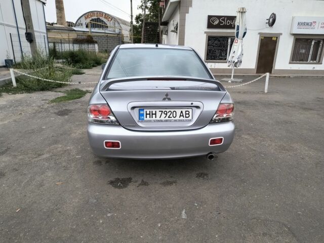 Серый Мицубиси Лансер, объемом двигателя 2 л и пробегом 212 тыс. км за 4300 $, фото 7 на Automoto.ua