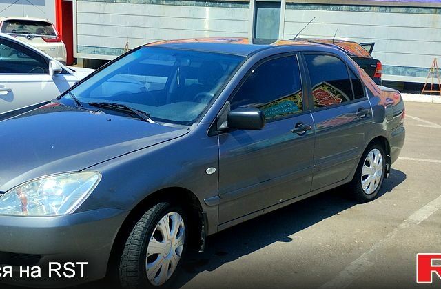 Сірий Міцубісі Lancer, об'ємом двигуна 1.6 л та пробігом 214 тис. км за 3800 $, фото 3 на Automoto.ua