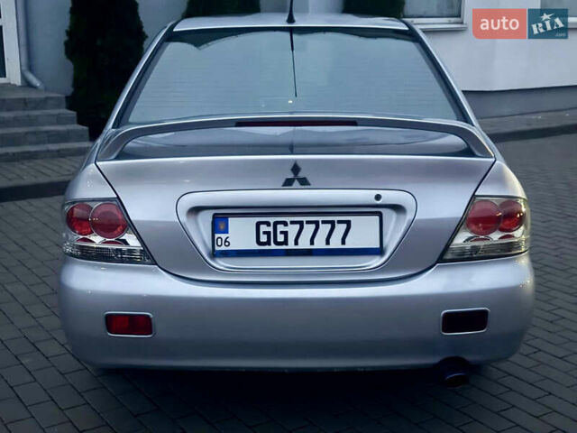 Серый Мицубиси Лансер, объемом двигателя 2 л и пробегом 188 тыс. км за 4200 $, фото 3 на Automoto.ua