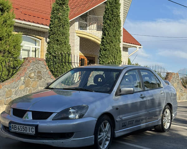 Сірий Міцубісі Lancer, об'ємом двигуна 2 л та пробігом 346 тис. км за 3200 $, фото 4 на Automoto.ua