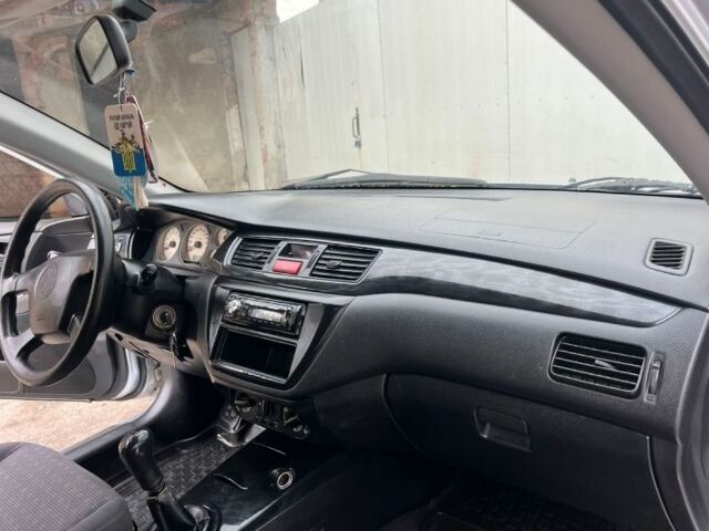 Серый Мицубиси Лансер, объемом двигателя 1.6 л и пробегом 178 тыс. км за 3200 $, фото 5 на Automoto.ua