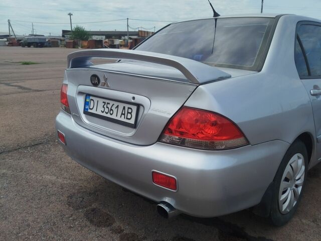 Серый Мицубиси Лансер, объемом двигателя 1.6 л и пробегом 250 тыс. км за 3600 $, фото 15 на Automoto.ua