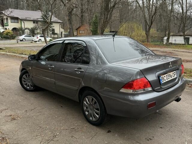 Сірий Міцубісі Lancer, об'ємом двигуна 1.6 л та пробігом 230 тис. км за 2799 $, фото 11 на Automoto.ua