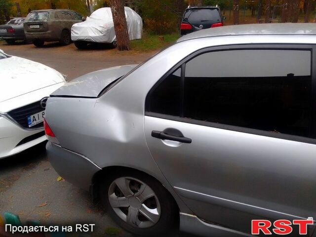 Сірий Міцубісі Lancer, об'ємом двигуна 1.6 л та пробігом 360 тис. км за 1999 $, фото 3 на Automoto.ua