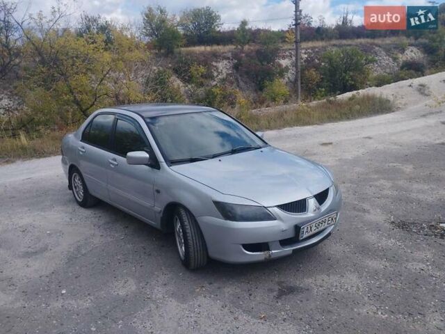 Сірий Міцубісі Lancer, об'ємом двигуна 1.6 л та пробігом 244 тис. км за 3300 $, фото 1 на Automoto.ua