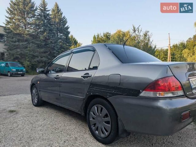 Сірий Міцубісі Lancer, об'ємом двигуна 1.58 л та пробігом 384 тис. км за 2500 $, фото 8 на Automoto.ua