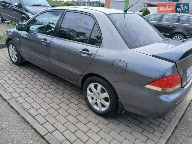 Сірий Міцубісі Lancer, об'ємом двигуна 1.58 л та пробігом 200 тис. км за 4000 $, фото 1 на Automoto.ua