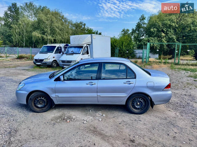 Сірий Міцубісі Lancer, об'ємом двигуна 1.58 л та пробігом 292 тис. км за 5000 $, фото 5 на Automoto.ua