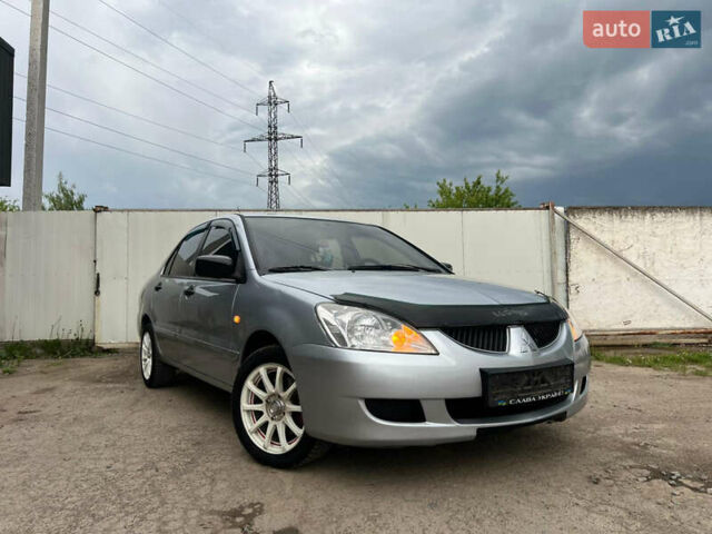 Сірий Міцубісі Lancer, об'ємом двигуна 1.6 л та пробігом 310 тис. км за 3350 $, фото 10 на Automoto.ua