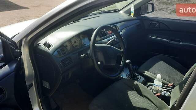 Сірий Міцубісі Lancer, об'ємом двигуна 1.58 л та пробігом 250 тис. км за 5000 $, фото 1 на Automoto.ua