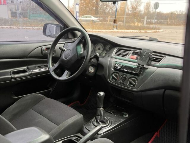 Серый Мицубиси Лансер, объемом двигателя 1.6 л и пробегом 250 тыс. км за 2600 $, фото 4 на Automoto.ua