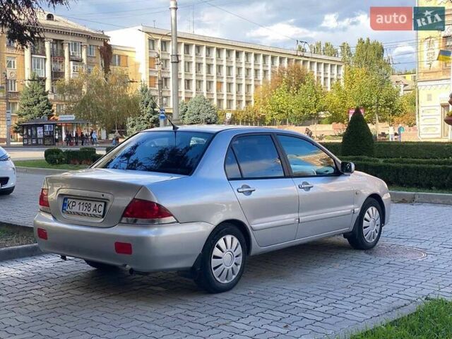 Серый Мицубиси Лансер, объемом двигателя 1.58 л и пробегом 200 тыс. км за 3850 $, фото 1 на Automoto.ua
