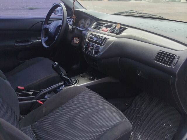 Серый Мицубиси Лансер, объемом двигателя 1.6 л и пробегом 250 тыс. км за 3600 $, фото 23 на Automoto.ua