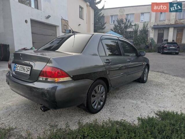 Сірий Міцубісі Lancer, об'ємом двигуна 1.58 л та пробігом 384 тис. км за 2500 $, фото 7 на Automoto.ua