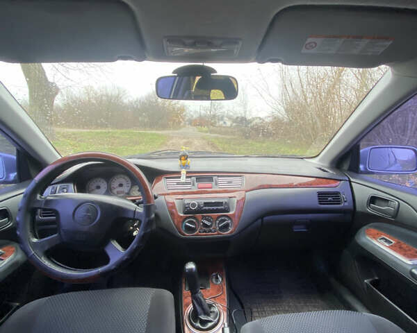 Серый Мицубиси Лансер, объемом двигателя 1.58 л и пробегом 210 тыс. км за 3900 $, фото 7 на Automoto.ua