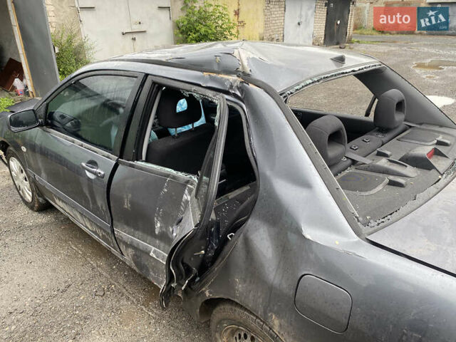 Сірий Міцубісі Lancer, об'ємом двигуна 1.58 л та пробігом 97 тис. км за 2000 $, фото 6 на Automoto.ua