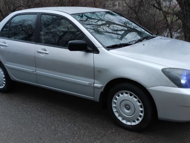 Серый Мицубиси Лансер, объемом двигателя 1.6 л и пробегом 235 тыс. км за 2850 $, фото 6 на Automoto.ua