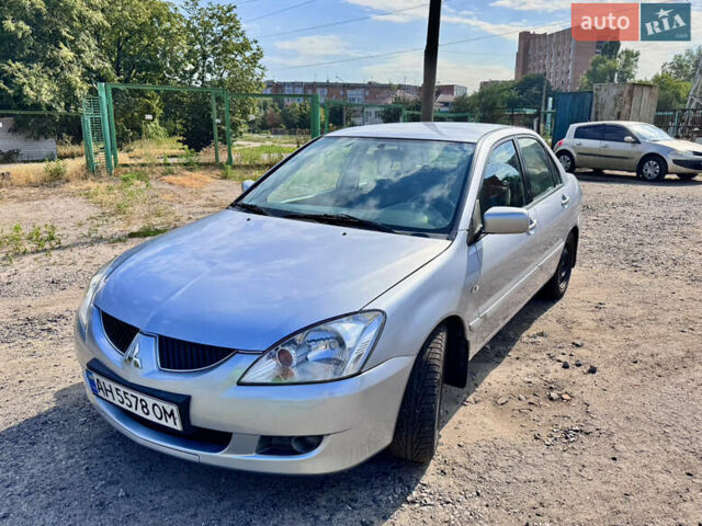 Сірий Міцубісі Lancer, об'ємом двигуна 1.58 л та пробігом 292 тис. км за 5000 $, фото 19 на Automoto.ua