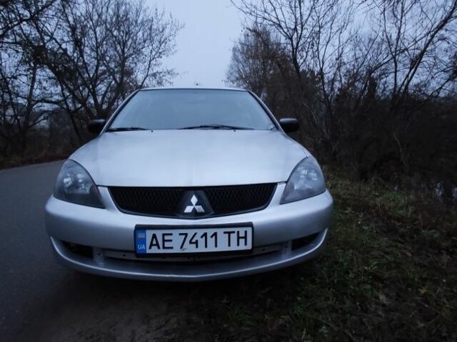 Серый Мицубиси Лансер, объемом двигателя 1.6 л и пробегом 235 тыс. км за 2850 $, фото 21 на Automoto.ua