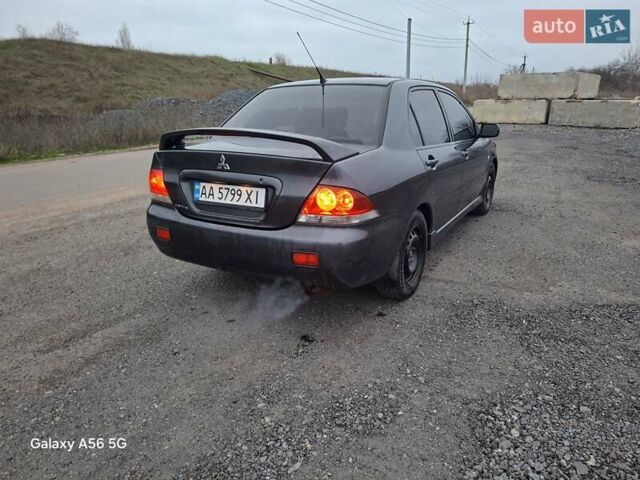Серый Мицубиси Лансер, объемом двигателя 1.6 л и пробегом 305 тыс. км за 4000 $, фото 2 на Automoto.ua