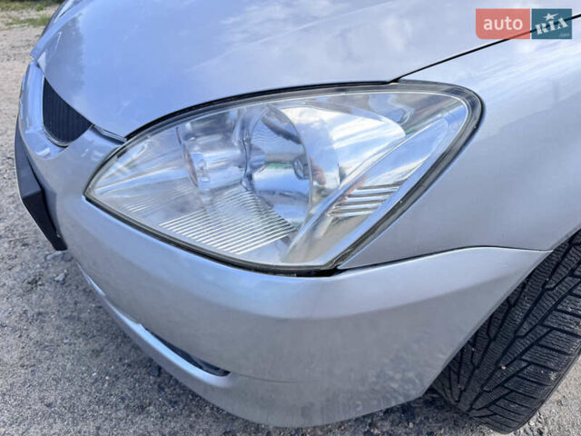 Сірий Міцубісі Lancer, об'ємом двигуна 1.58 л та пробігом 292 тис. км за 5000 $, фото 4 на Automoto.ua