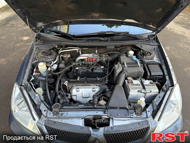 Серый Мицубиси Лансер, объемом двигателя 1.6 л и пробегом 300 тыс. км за 3850 $, фото 8 на Automoto.ua